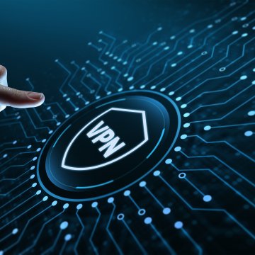 surfshark vpn services review hand pressing on vpn button on circuit board